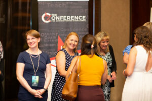 Administrative professionals networking at a conference
