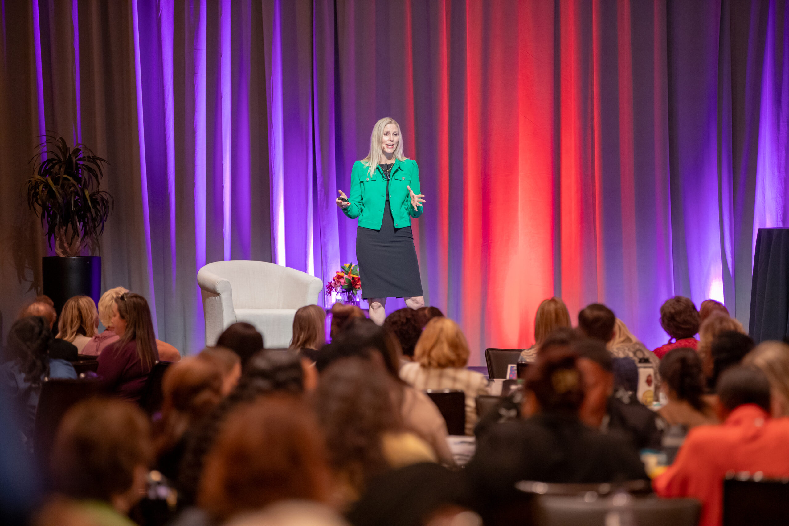 Alexandra Von Tiergarten presenting how to future-proof your administrative career on stage at the Conference for Administrative Excellence.