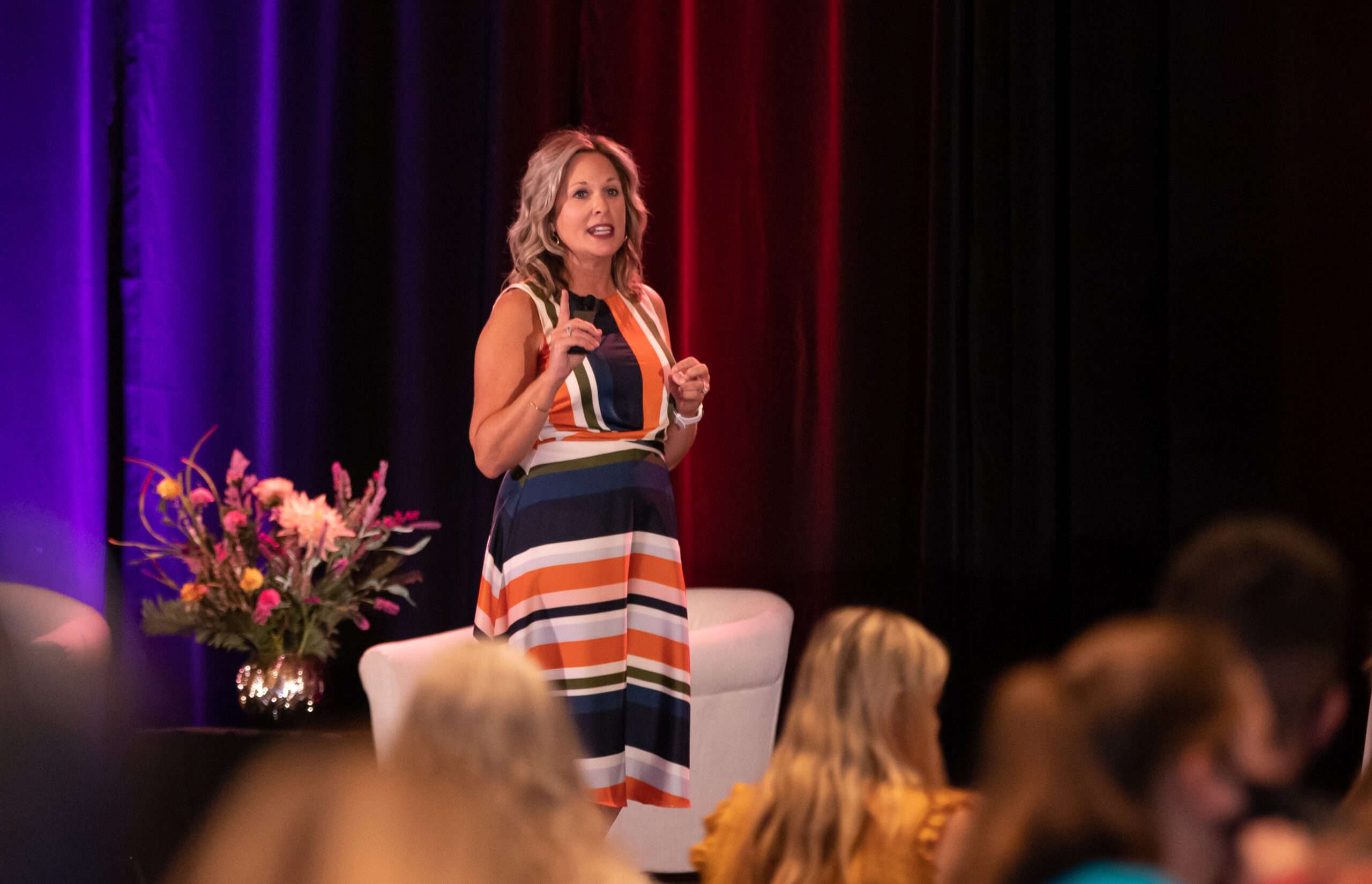 AI for Administrative Professionals - guest blogger Reanette Etzler on a stage presenting to an audience