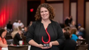 2024 Joan Burge Innovation Award Contest winner Andrea Jones-Pascoe holds her award.