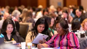 Executive assistants engaged in experiential learning activities at conference